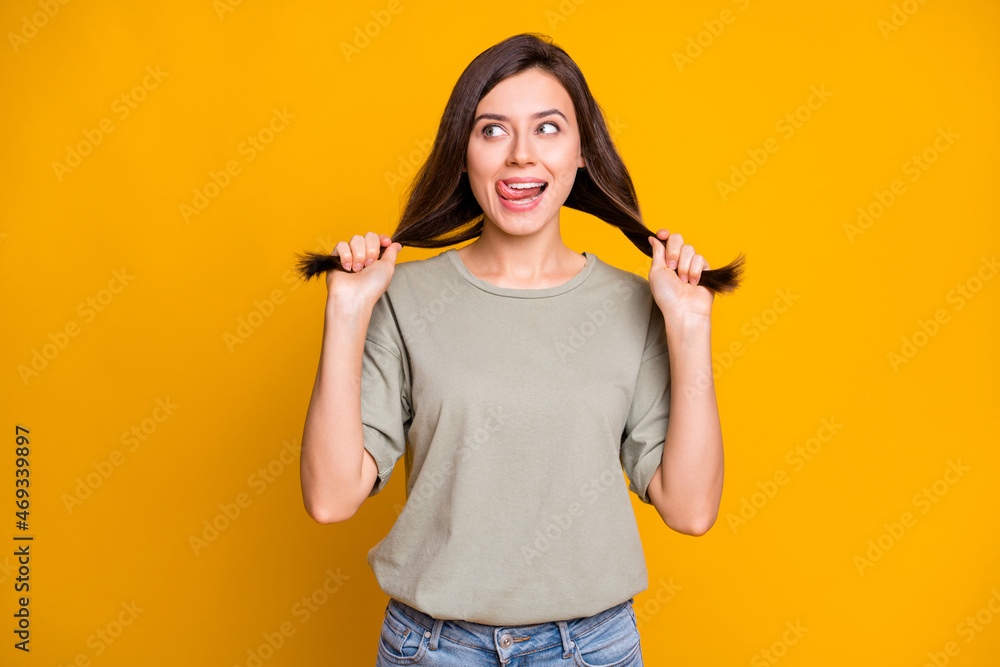Photo of young lovely pretty funky smiling cheerful girl lick lips pull tails look copyspace isolated on yellow color background Photo of young lovely pretty funky smiling cheerful girl lick lips pull tails look copyspace isolated on yellow color background