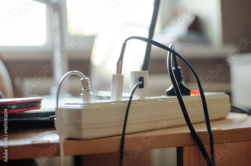 Connection in electric devices in an extension cord, close-up, home furnishings. photo