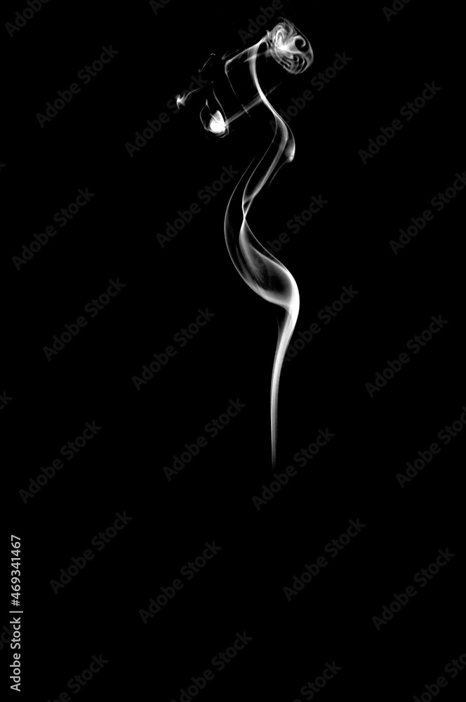 Abstract white smoke on black background. Vertical monochrome, grayscale photography of illuminated incense. Moody feeling. Dark backdrop, graphic resource for montage, overlay or texture, copy space. Abstract white smoke on black background. Vertical monochrome, grayscale photography of illuminated incense. Moody feeling. Dark backdrop, graphic resource for montage, overlay or texture, copy space.