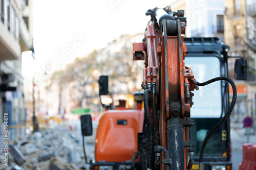 Excavator on urban street