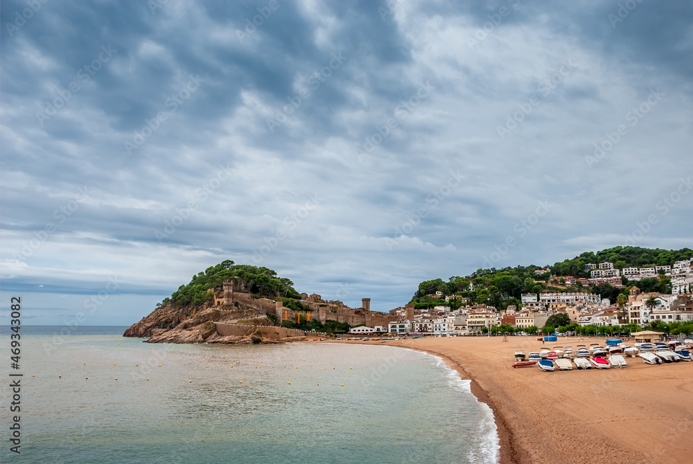 Tossa De Mar, Catalonia, Spain. A picturesque town with a fortress, with beautiful beaches and clean turquoise water in cozy bays near Barcelona. Famous tourist destination Costa Brava.
