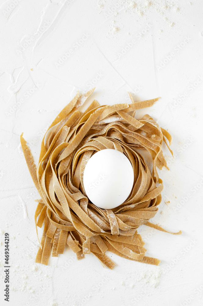 Fototapeta premium Chestnut uncooked chestnut tagliatelle. White background
