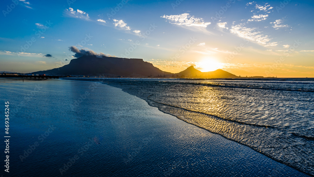 A beautiful sunset over the Table mountain in South Africa from the Lagoon beach.