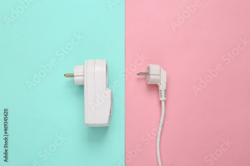 Fuse power outlet and power plug on blue pink pastel background