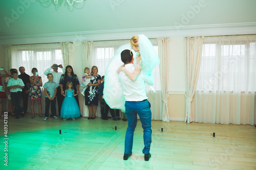First wedding dance of newlywed couple in restaurant