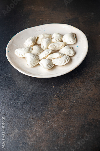 vareniki raw dough stuffed dumplings ready to eat meal snack on the table copy space food background