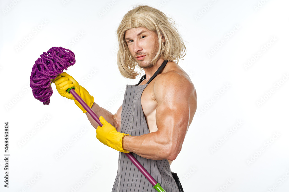 muscular man in apron with a mop in a woman's wig Stock Photo | Adobe Stock