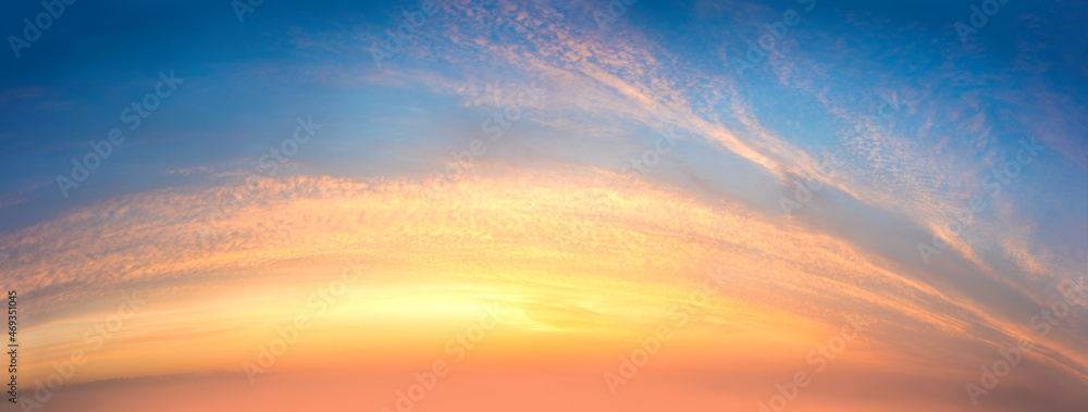 Panoramic Awe sunrise sundown sky background with light colorful clouds