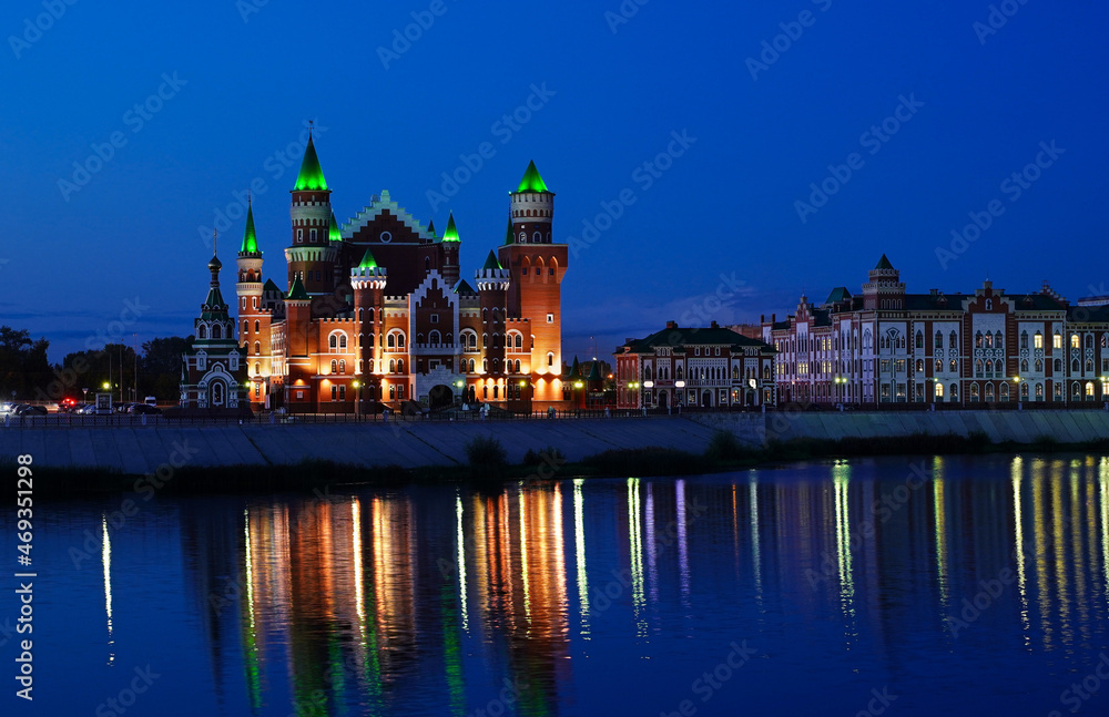 Yoshkar-Ola, Russia - September 6, 2021. Republican Puppet Theater Mari El. Bruges embankment. Opened in 2014. Evening cityscape