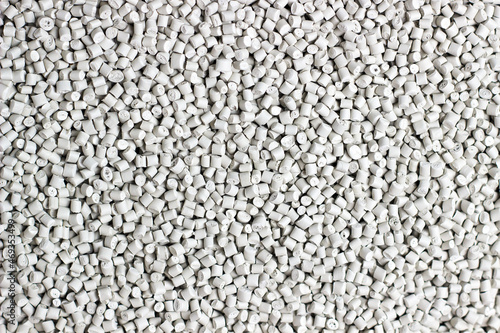 Many white and gray granules of polypropylene, polyamide. Background. Plastic and polymer industry, industry. Microplastic products.