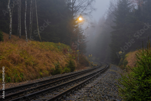 Railroad track near Jedlova station in Luzicke mountains in autumn morning photo