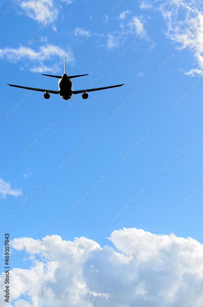 flight of the airplane (jet) over beautiful blue sky with white clouds flight of the airplane (jet) over beautiful blue sky with white clouds