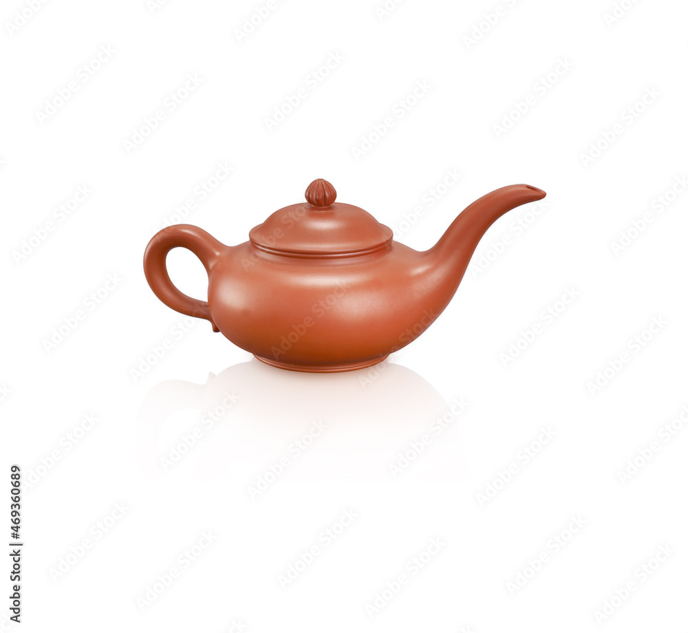 Ceramic teapot handmade isolated on a grey background
