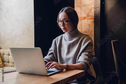 Pretty Young Beauty Woman Using Laptop in cafe, outdoor portrait business woman, hipster style, internet, smartphone, office, Bali Indonesia, holding, mac OS, manager, freelancer