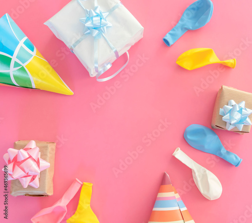 Decorations for birthday on a pink background.Balloons and gifts