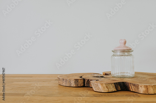 Glass jar on wooden table with copy space
