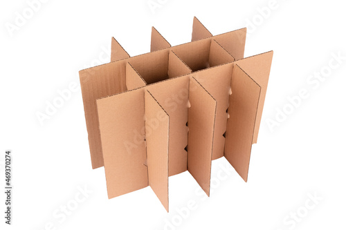Cardboard grid or box cell deviders package for glass bottles packaging and transportation isolated on white. Adjustable carton box devider made with recycled corrugated cardboard. Selective focus photo