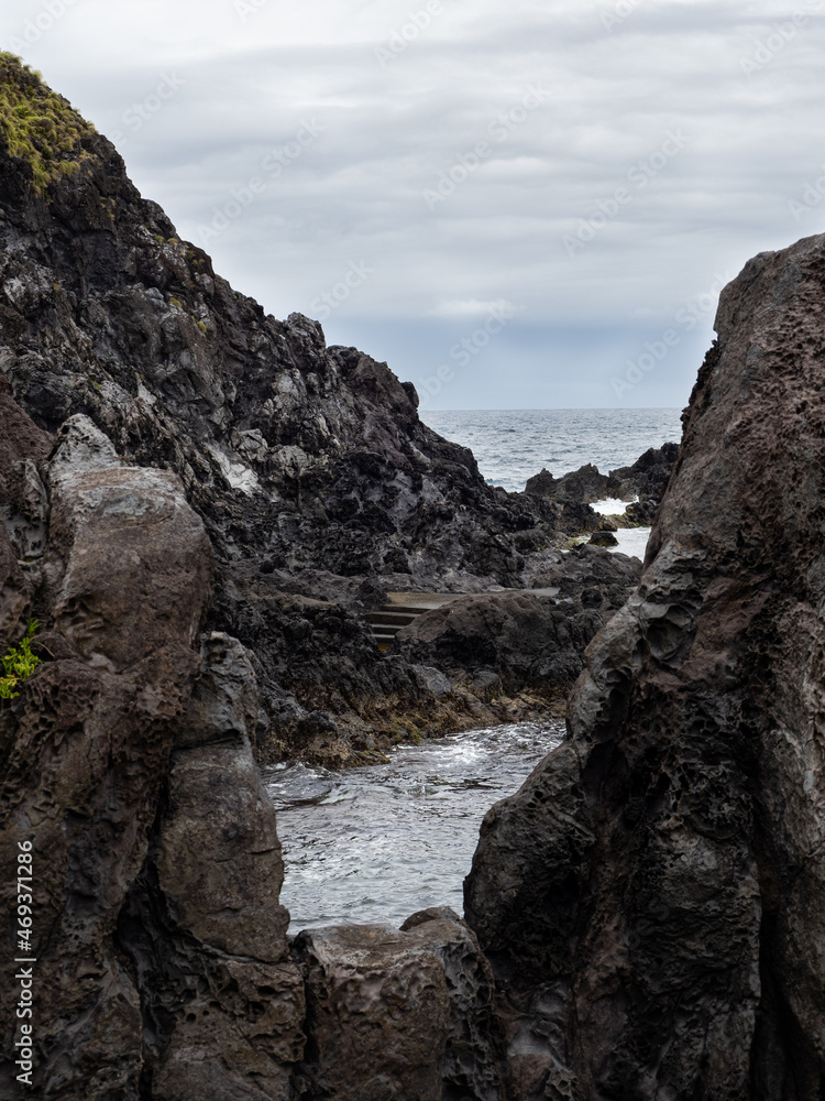 Natural pools delimited by volcanic rocks in the bathing area of Boqueirão. Breathtaking textures and green vegetation contrasting with the black color of the rocks.
Flores Island. Natural pools delimited by volcanic rocks in the bathing area of Boqueirão. Breathtaking textures and green vegetation contrasting with the black color of the rocks.
Flores Island.