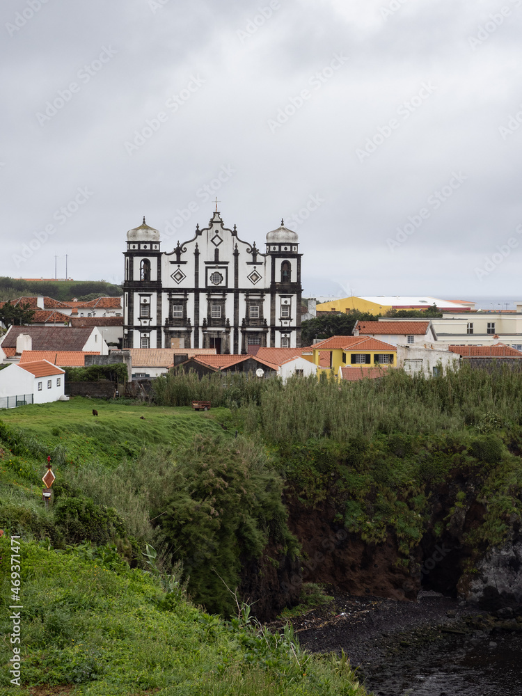 The imposing façade of the mother church of Santa Cruz das Flores seen from Boavista Park. Is one of the largest in the entire archipelago of the Azores. Flores Island.