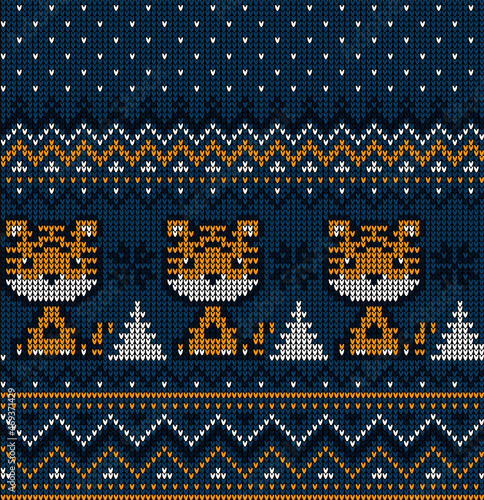 Knitted Christmas and New Year pattern in Tiger. Wool Knitting Sweater Design. Wallpaper wrapping paper textile print.