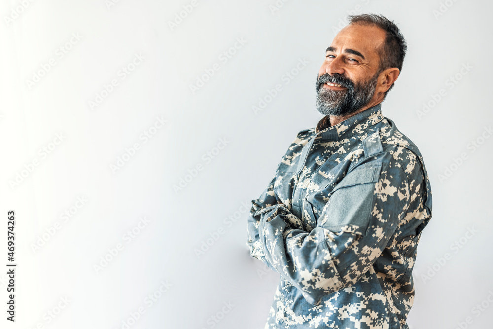 Portrait of a handsome man in his United States military uniform; copy space. Happy Military Man. US Mature soldier portrait. Handsome African american male soldier in the uniform of US forces Portrait of a handsome man in his United States military uniform; copy space. Happy Military Man. US Mature soldier portrait. Handsome African american male soldier in the uniform of US forces