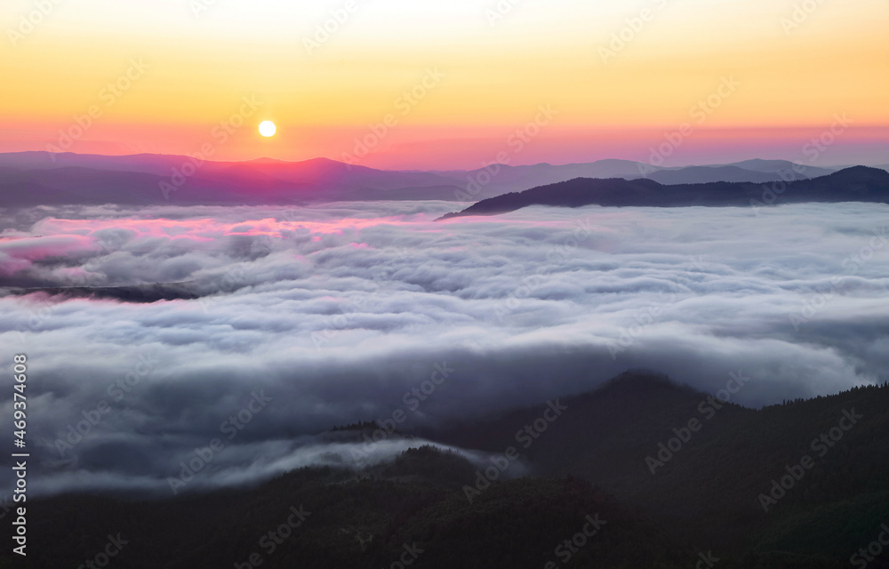 Landscape with high mountains. Fields and meados are covered with morning fog and dew. Sunrise. Forest of the pine trees. The early morning mist. Touristic place. Natural scenery. Landscape with high mountains. Fields and meados are covered with morning fog and dew. Sunrise. Forest of the pine trees. The early morning mist. Touristic place. Natural scenery.