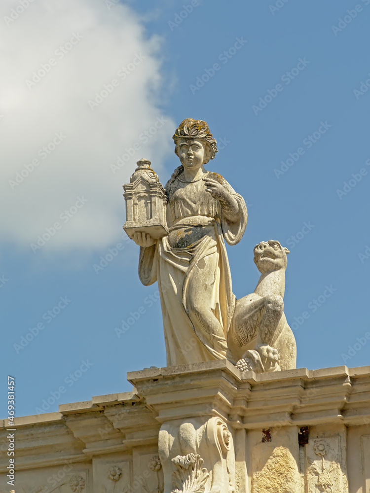 Statue of a woman holding a lantern, detail of the medieval city gate f Alba Iulia