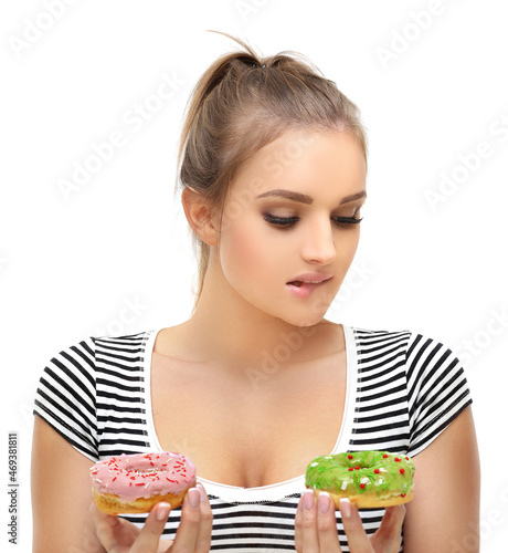 Funny girl and colorful donuts.