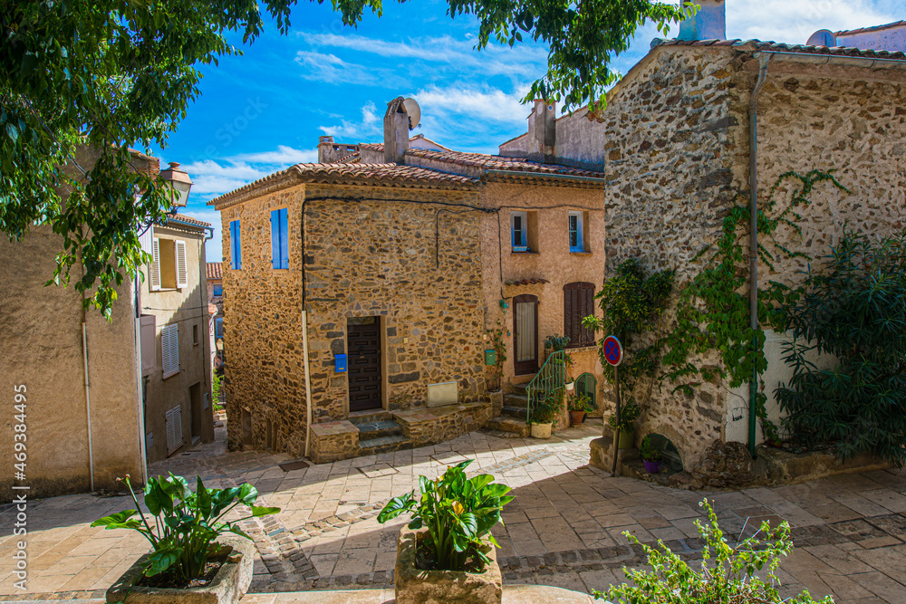 Old stone houses with blue shutters in Grimaund - France, Departement Var, Côte d‘Azur