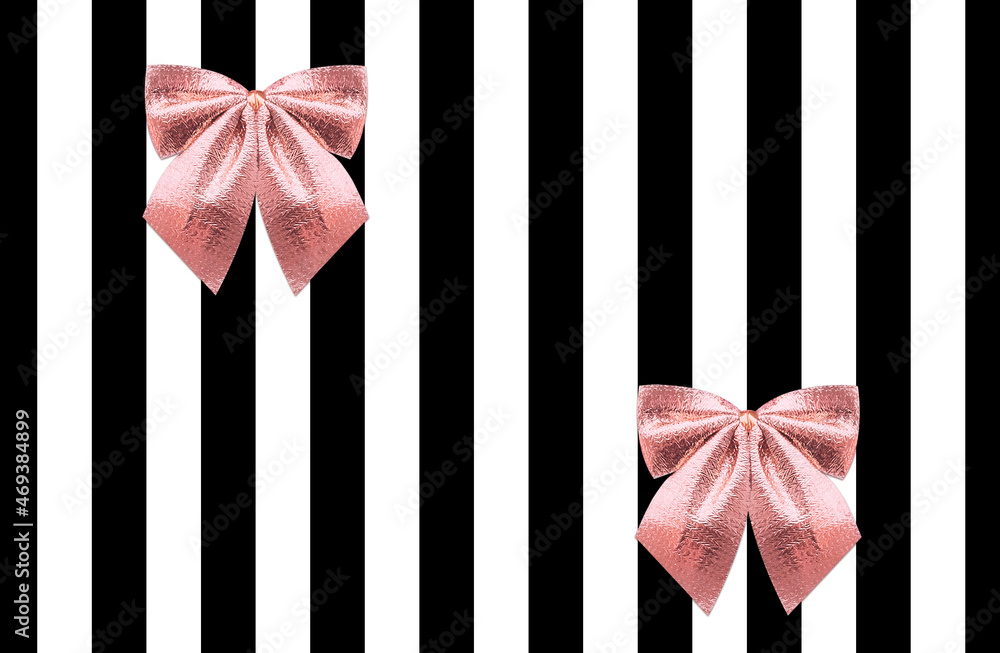 Naklejka premium Gift wrap design template in romantic style. Glowing rose gold bows on black-white striped backdrop