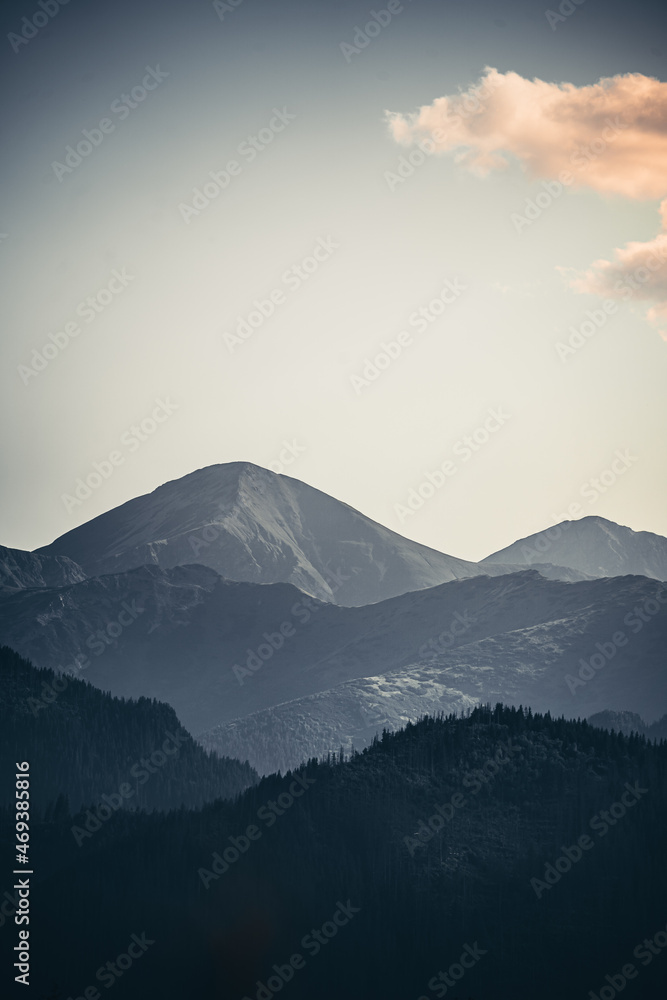 Mountain landscape with one small cloud on the sky Mountain landscape with one small cloud on the sky