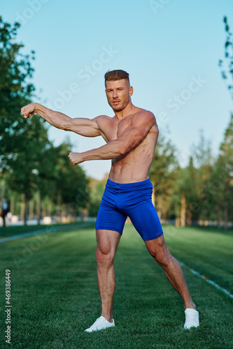 man doing exercises in the park inflated body © VICHIZH