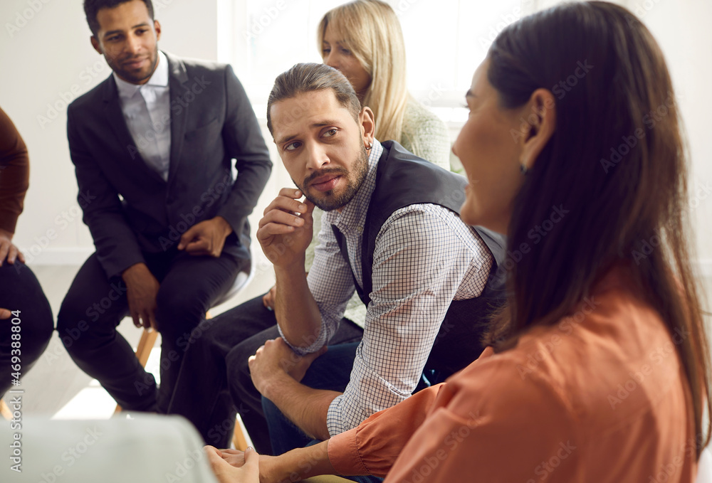Diverse team of people talking during a meeting. Group of mixed race multi ethnic men and women discussing different problems, telling stories, sharing thoughts, listening to each other's suggestions Diverse team of people talking during a meeting. Group of mixed race multi ethnic men and women discussing different problems, telling stories, sharing thoughts, listening to each other's suggestions