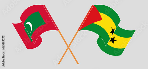 Crossed and waving flags of Maldives and Sao Tome and Principe