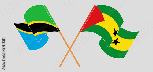Crossed and waving flags of Tanzania and Sao Tome and Principe