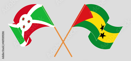 Crossed and waving flags of Burundi and Sao Tome and Principe