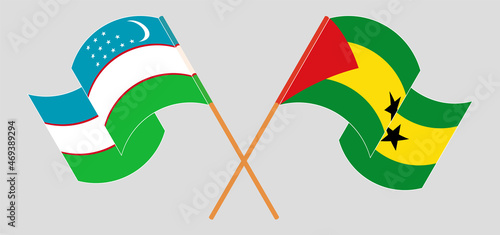 Crossed and waving flags of Uzbekistan and Sao Tome and Principe