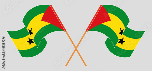 Crossed and waving flags of Sao Tome.