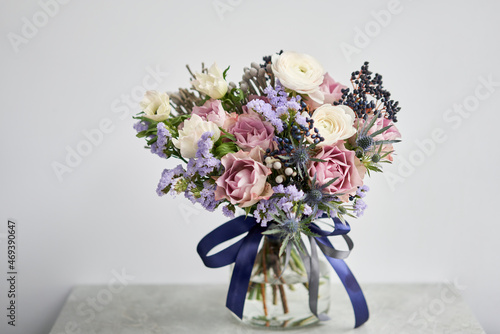Beautiful bouquet of mixed flowers with ranunculus clooney hanoi. Floral shop concept . Beautiful fresh cut bouquet. Flowers delivery photo