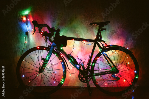 Fototapeta Naklejka Na Ścianę i Meble -  Bicycle decorated with Christmas lights