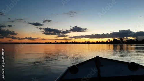 Boat trip on the Araguaia river at dusk with a beautiful sunset. State of Tocantins, Brazil. photo