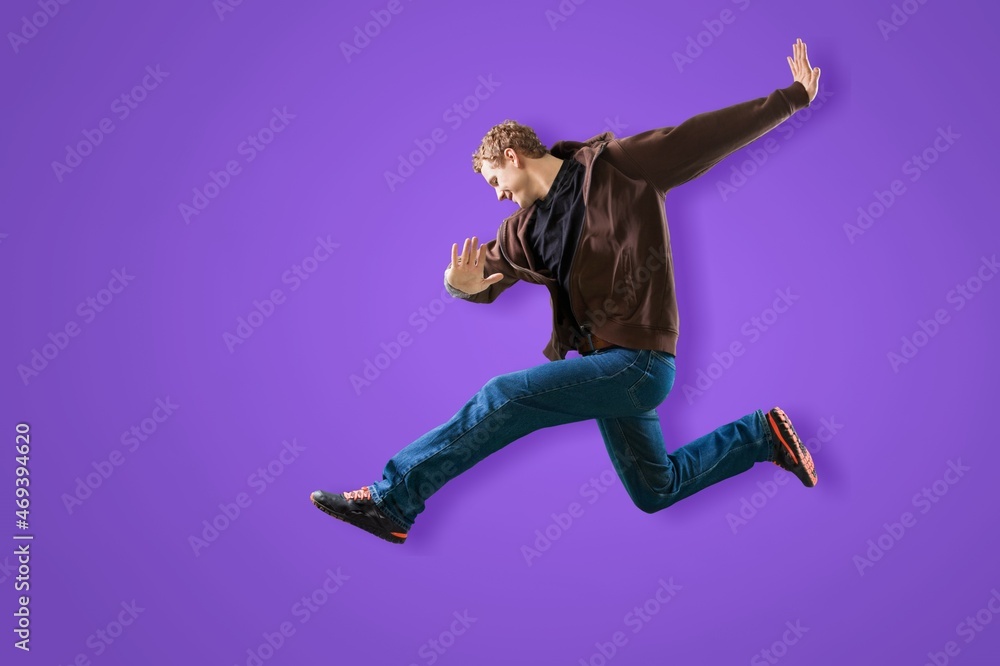 Happy young crazy man jump up to celebrate