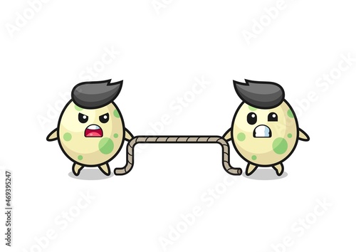 cute spotted egg character is playing tug of war game