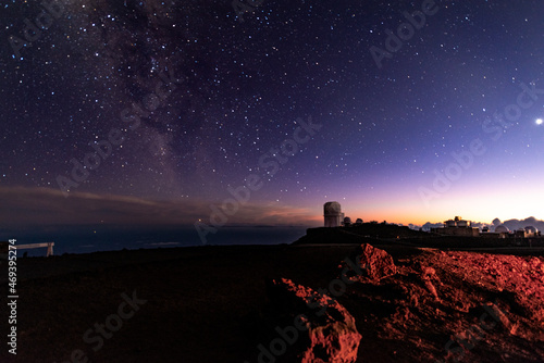 Night view from Haleakala National Park, with the Observatory and Milky Way on the background - Maui, Hawaii, United States.