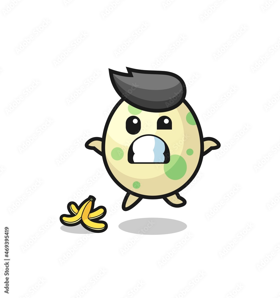 Fototapeta premium spotted egg cartoon is slip on a banana peel
