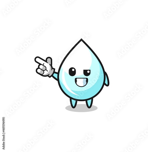 milk drop mascot pointing top left