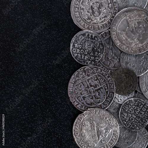 Closeup view of medieval European silver coins.Zygmunt III Waza.Ancient silver coins.Numismatics.silver coins covered in dirt.Antikvariat. photo