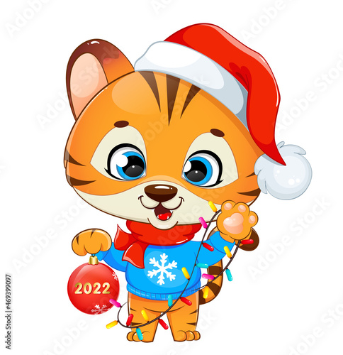 Merry Christmas. Cute tiger cub in Santa hat