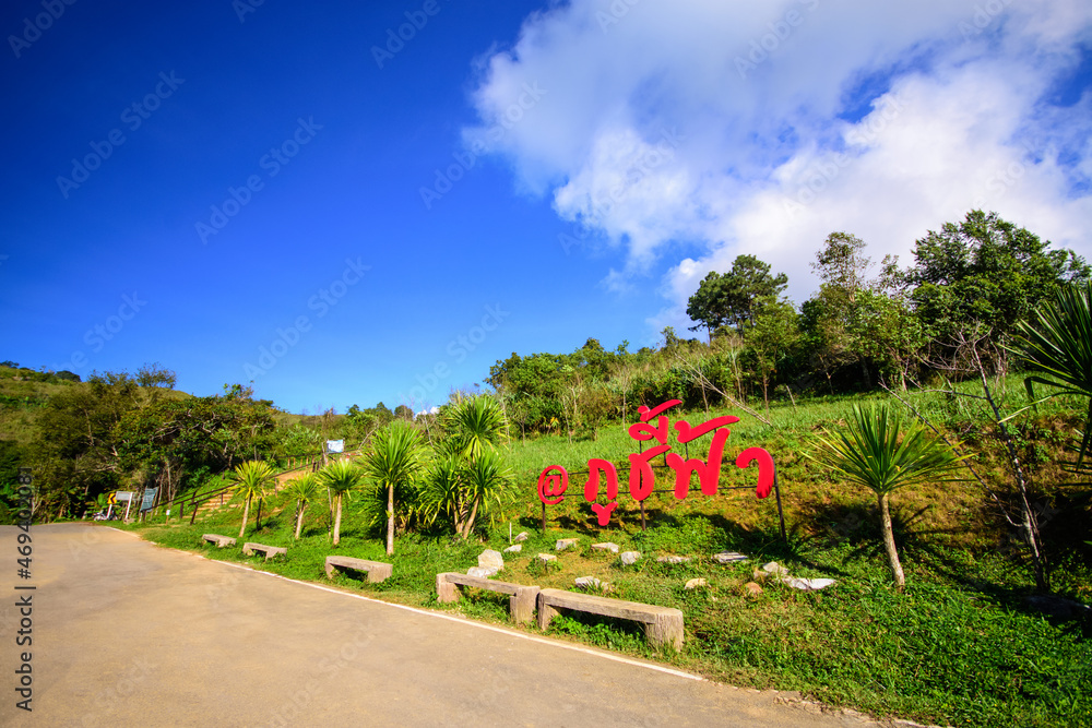 Nameplate(Phu Chi Fa) viewpoint and blue sky with white cloud above high mountain at Phu Chi Fa Forest Park in Chiang Rai Province Thailand