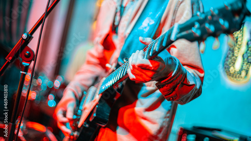 person playing guitar, hand with guitar